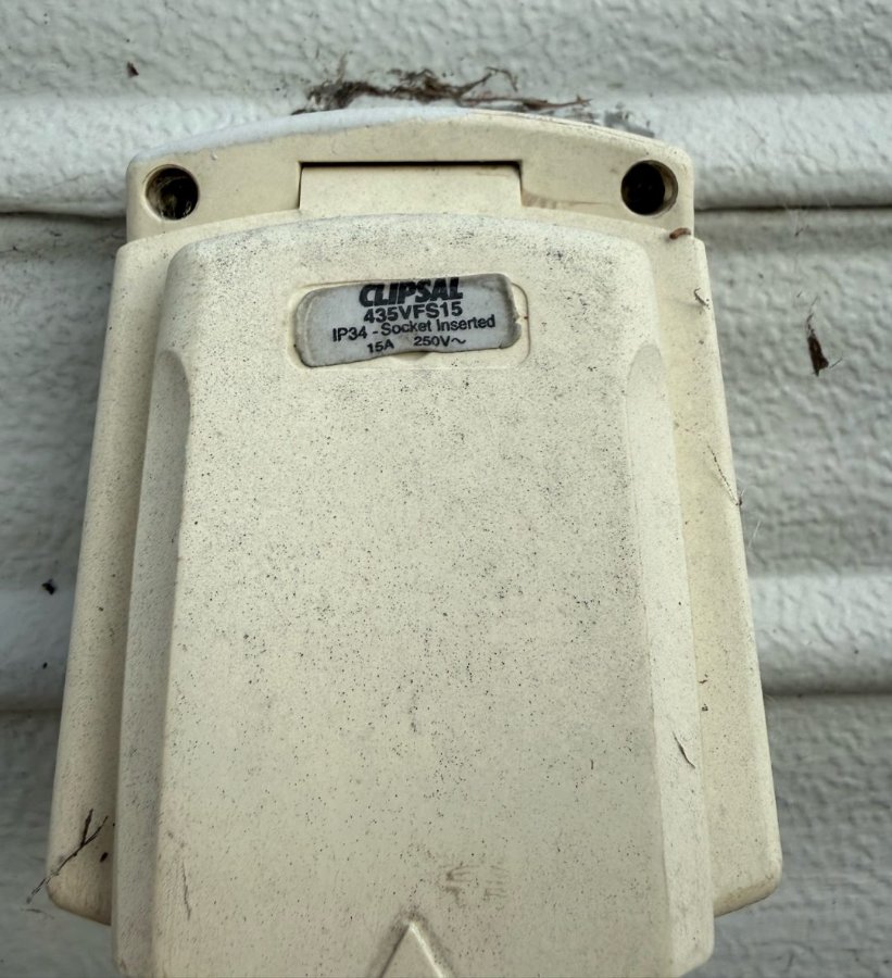 Worn caravan power inlet before replacement at Shelly Beach